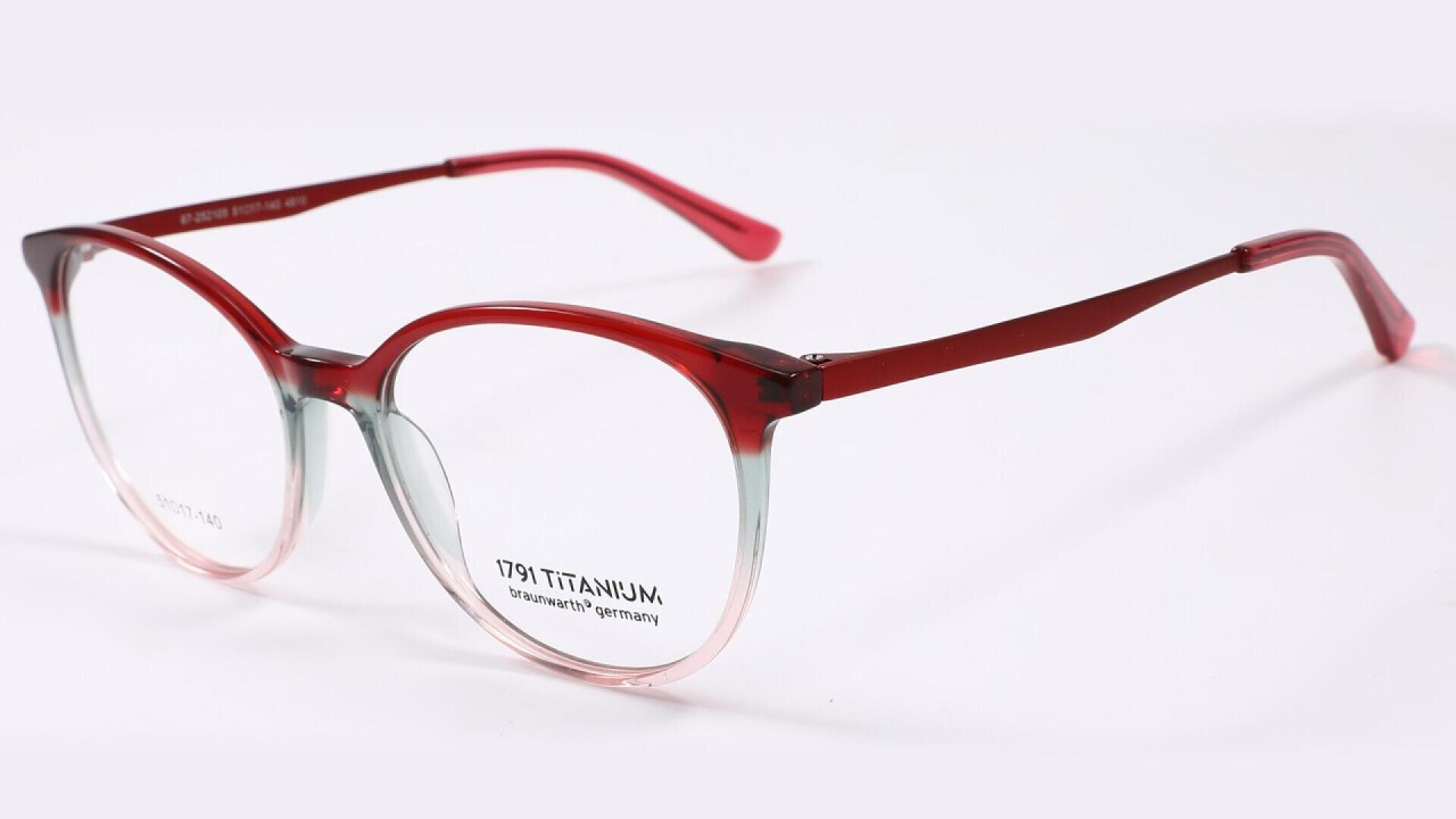 Red and clear gradient eyeglasses with round frames and thin temples, displayed on a plain white background. The brand name and titanium specification are visible on the lens.