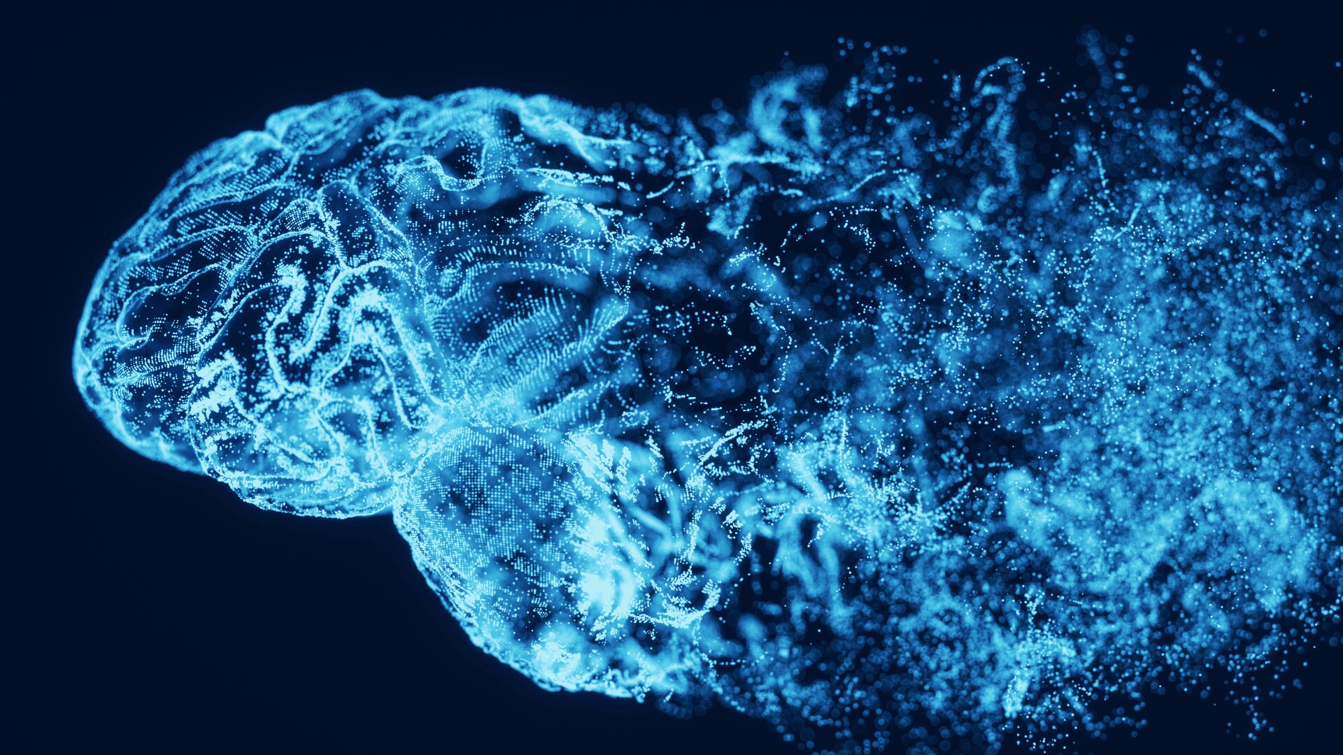 Digitale Illustration eines blauen Gehirns, das aus leuchtenden Partikeln und Linien besteht, wobei sich die rechte Seite in verstreute Punkte auflöst, vor einem dunklen Hintergrund.