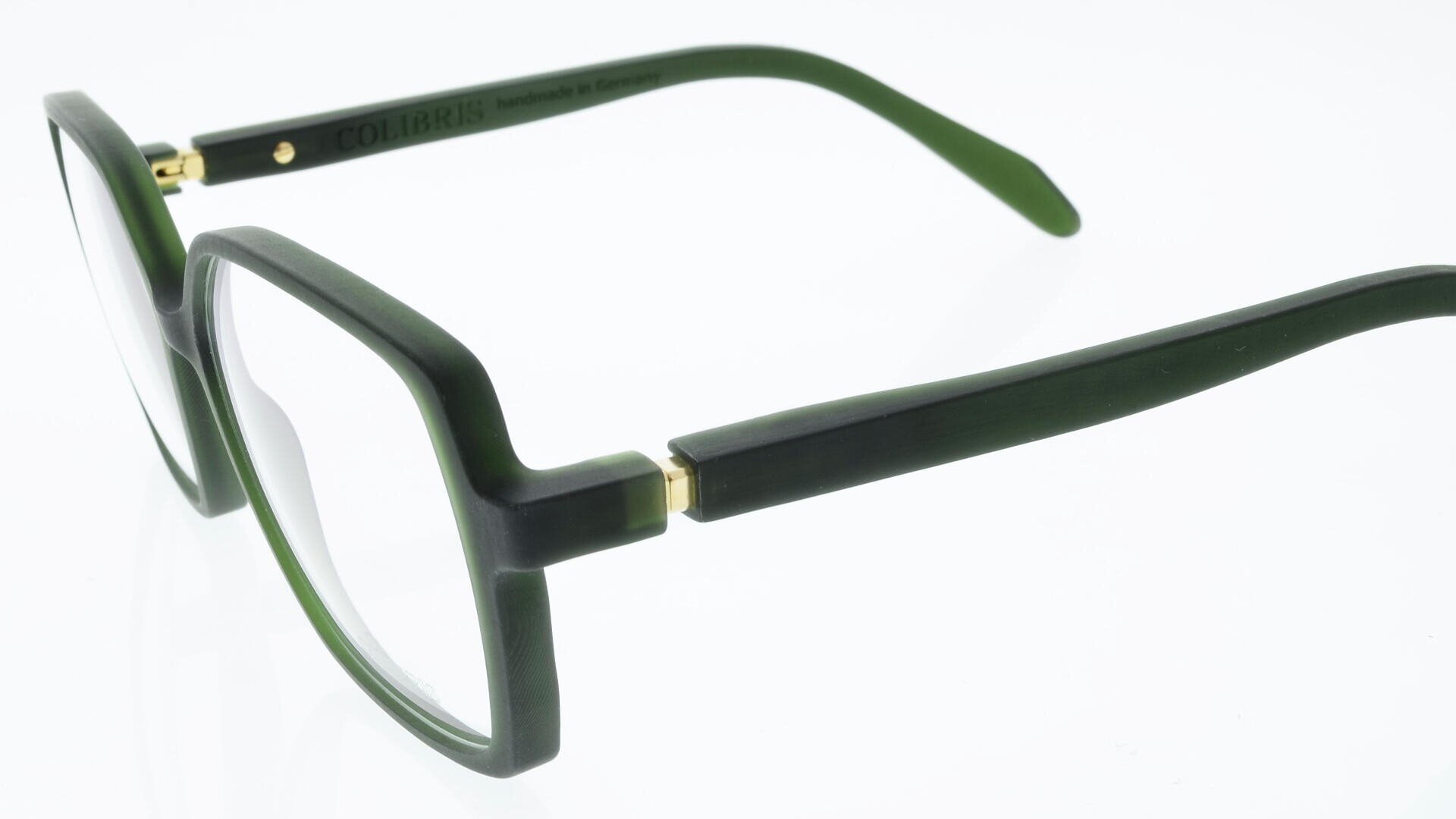 A pair of green, rectangular eyeglasses with thick frames and clear lenses, viewed at an angle from the side and back, showcasing the temple arms and hinge details.