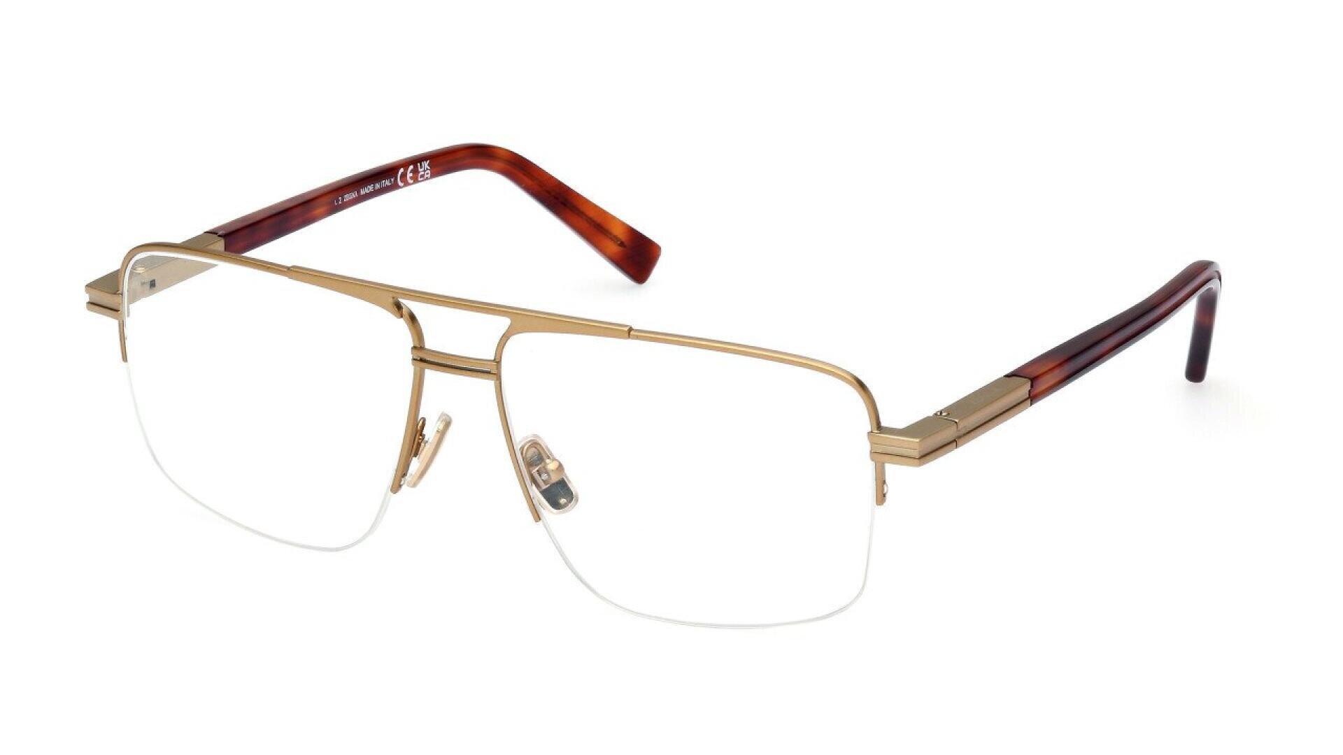 Rectangular semi-rimless eyeglasses with gold metal frame, clear lenses, adjustable nose pads, and brown tortoiseshell-patterned temple arms.