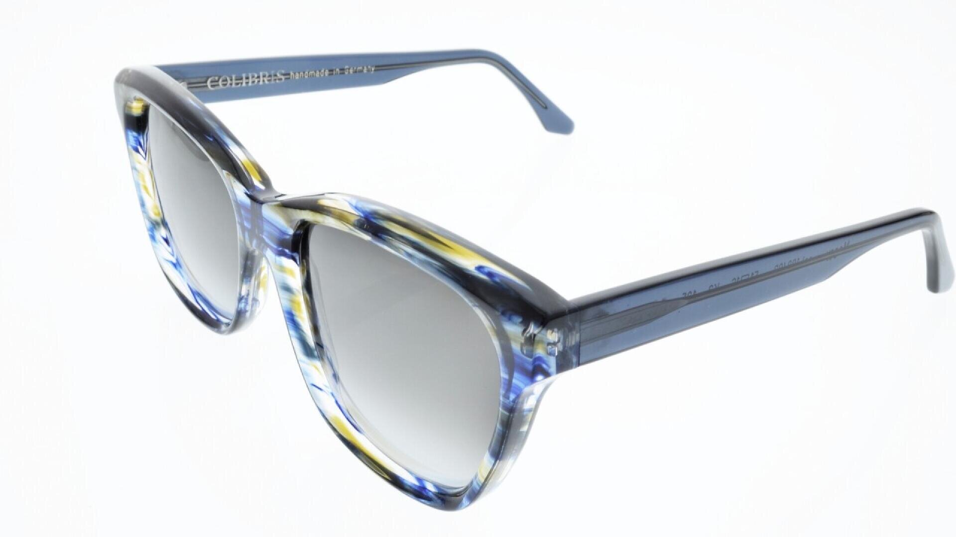 Blue and yellow marbled sunglasses with thick, cat-eye frames and gradient tinted lenses, displayed on a white background.