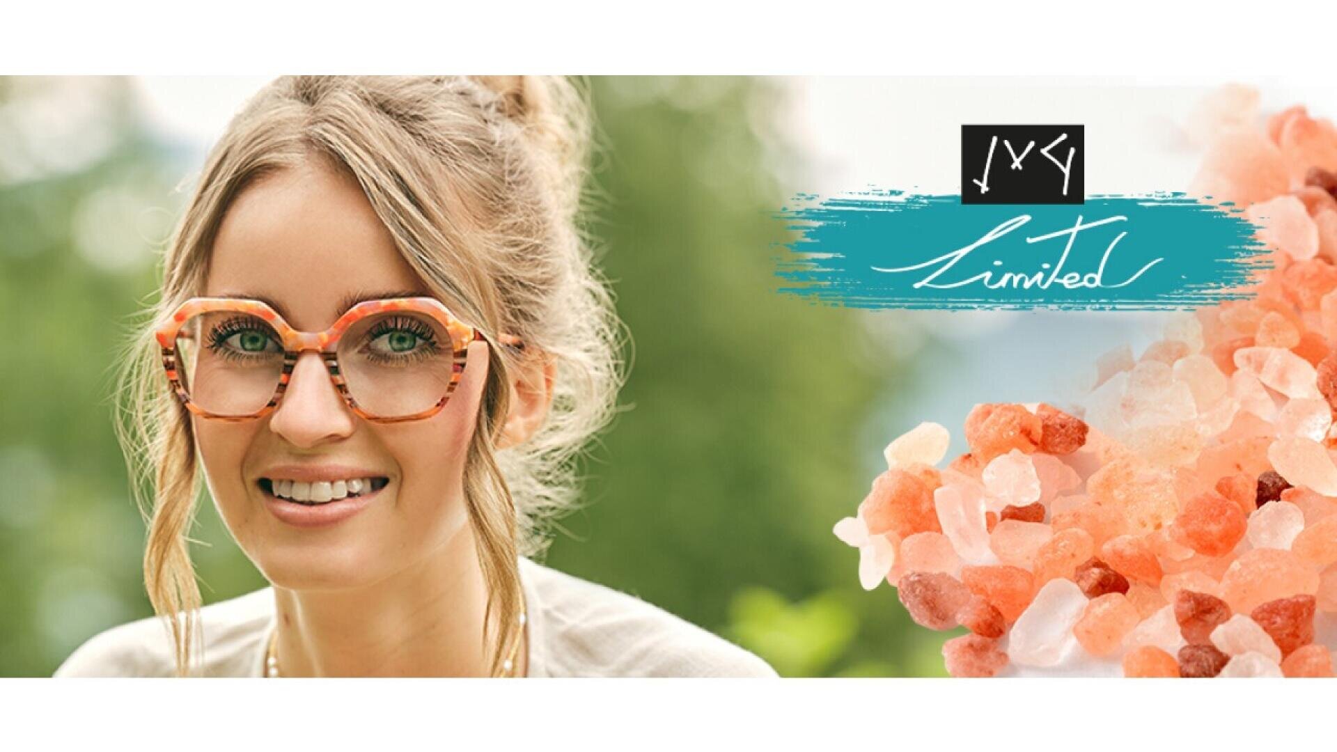 A smiling woman with blond hair in a loose bun wears large, colorful eyeglasses. Next to her are pink Himalayan salt crystals and a turquoise graphic with white cursive text that reads Limited.