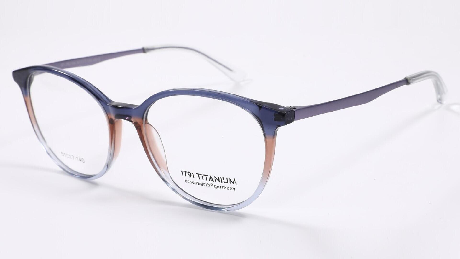 Round eyeglasses with blue and brown gradient frames, silver metal temples, and clear nose pads, displayed on a white background. The lens has text reading 1791 TITANIUM, brainART Germany.