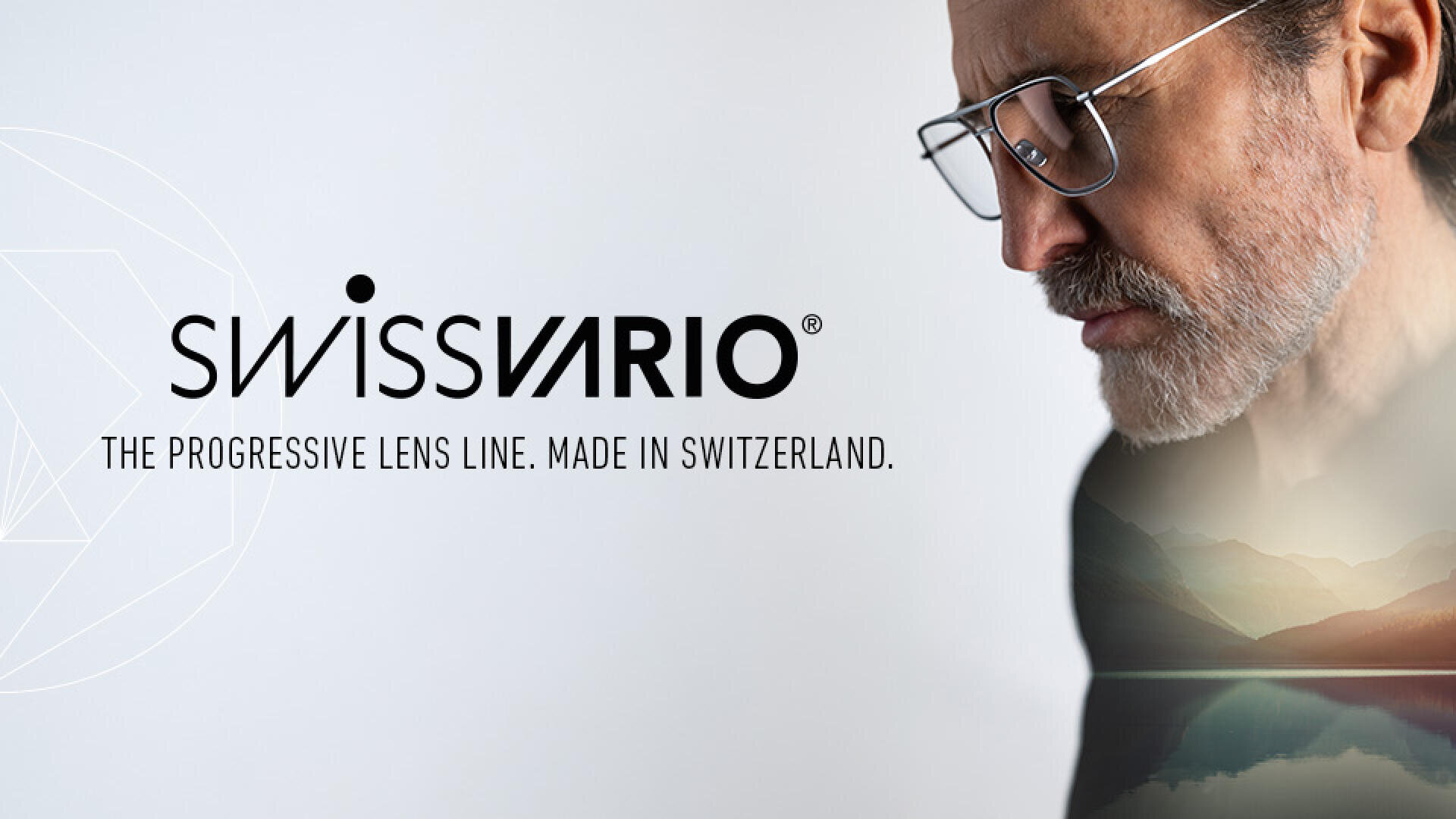 A man with glasses looks down, with mountains and a lake superimposed on his silhouette. The text reads: “SWISSVARIO. The progressive lens line. Made in Switzerland.”.