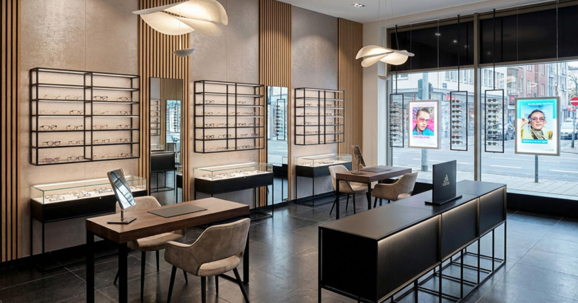 Modern optical store interior with display shelves of glasses, stylish lighting, chairs and tables for fittings. Large windows show the street outside and digital posters with faces wearing glasses. The space looks clean and organized.