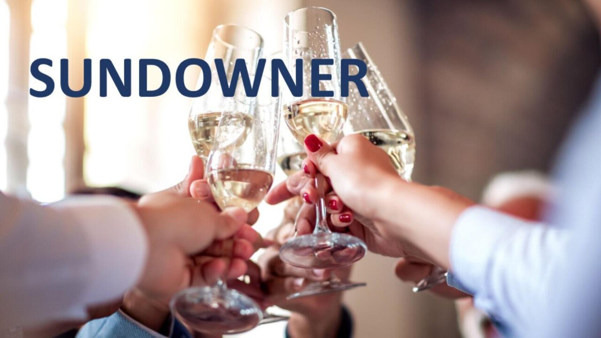 A group of people clink their wine glasses together in a toast. The word SUNDOWNER is overlaid in bold letters on the left side of the image.