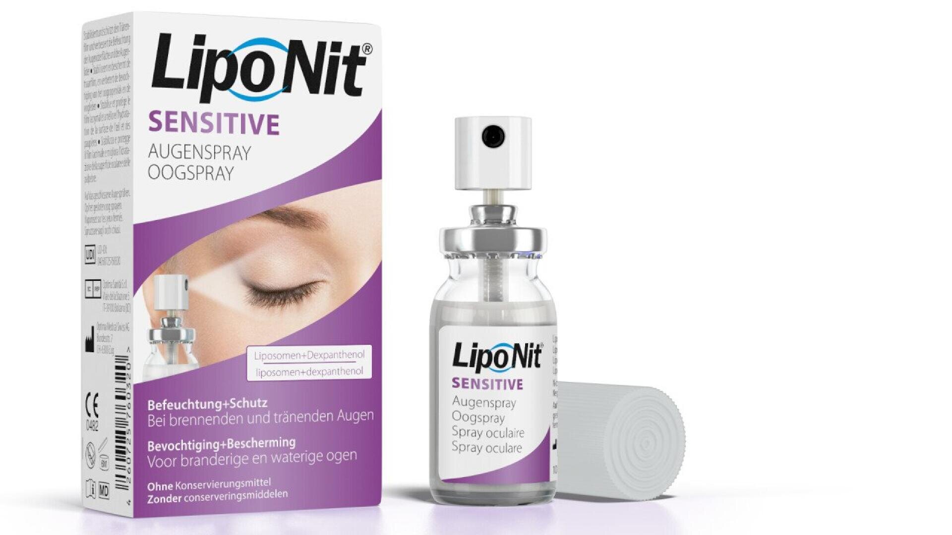 A box and spray bottle of LipoNit Sensitive Augenpray for eyes. The box displays an image of a closed eye and text in German and Dutch, and the bottle is clear with a white and purple label and spray nozzle.