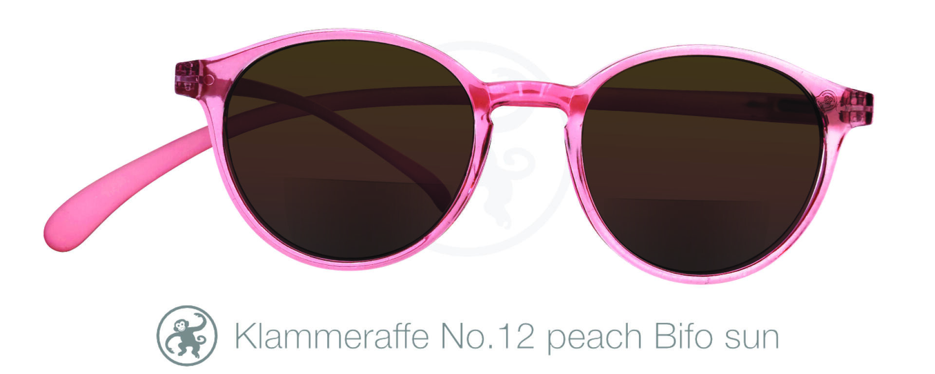 Round sunglasses with translucent pink frames and dark lenses. Below, text reads “Klammeraffe No.12 peach BiFo sun” with a small monkey logo next to the text.