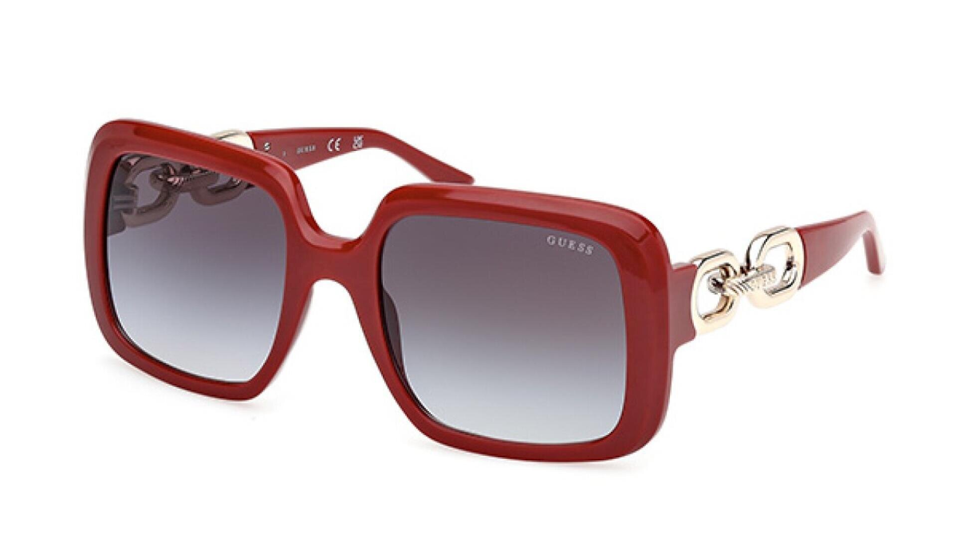 Red square-framed sunglasses with gradient dark lenses. The temples feature decorative silver accents with chain-like details, and the brand name GUESS is visible on the upper corner of the left lens.