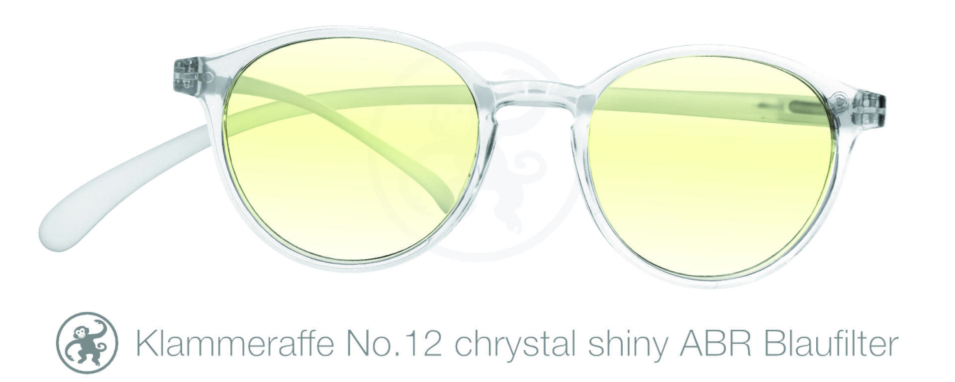 Round, transparent eyeglasses with pale yellow lenses are shown on a white background. Text below reads Klammeraffe No.12 chrystal shiny ABR Blaufilter with a small monkey logo to the left.