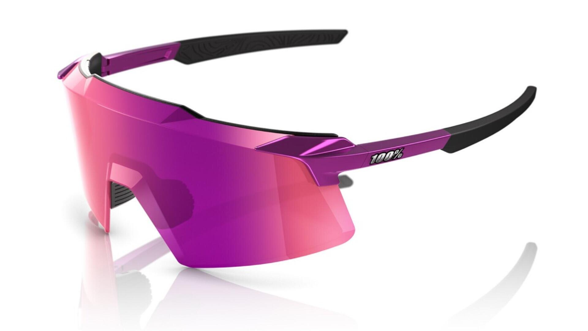 A pair of sports sunglasses with a single wraparound pink and purple lens, angular design, black arms, and 100% logo on the side, shown against a white background.